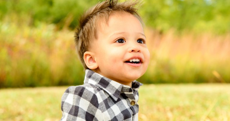 Tongue - toddler boy smiling outside - Gillespie Approach–Craniosacral Fascial Therapy