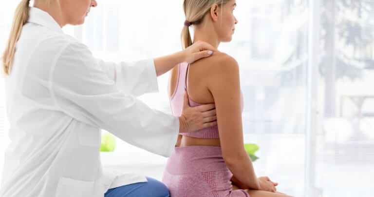 Adult and child hand placement - woman appointment - Gillespie Approach–Craniosacral Fascial Therapy