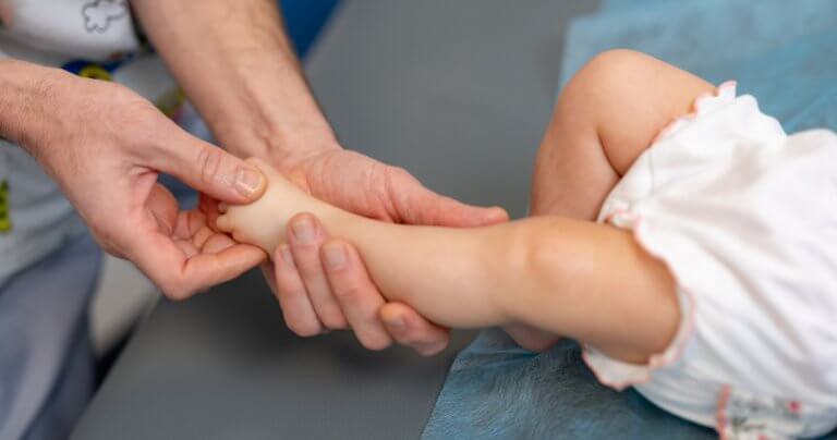 Infant hand placement - baby foot massage - Gillespie Approach–Craniosacral Fascial Therapy