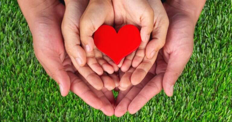Patient hand placement - red heart shape - Gillespie Approach–Craniosacral Fascial Therapy