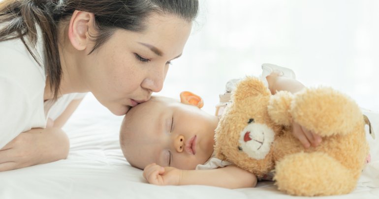 Gillespie Approach at birth - mother kissing baby - Gillespie Approach–Craniosacral Fascial Therapy