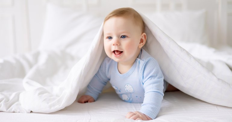 Born with arm wrapped behind head - baby peeking under covers - Gillespie Approach–Craniosacral Fascial Therapy