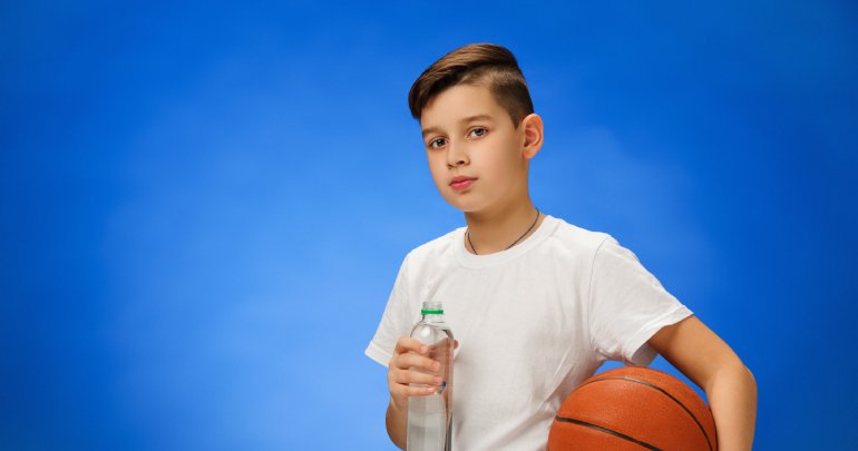 Medically complex child - boy holding basketball - Gillespie Approach–Craniosacral Fascial Therapy