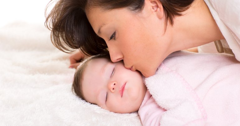 Lessons from a clubfoot baby - mother kissing baby - Gillespie Approachu–Craniosacral Fascial Therapy