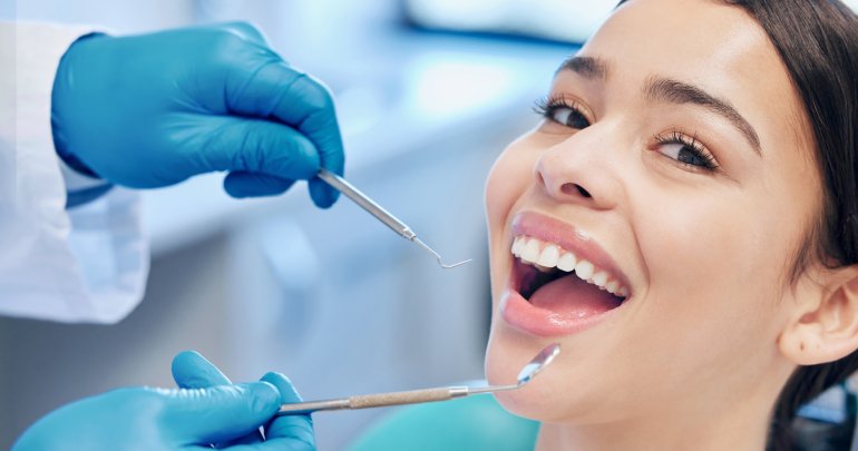Dentistry - birth trauma - young woman at dental office - Gillespie Approach–Craniosacral Fascial Therapy