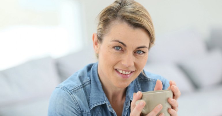 Fascial web knows best - woman holding drink - Gillespie Approach–Craniosacral Fascial Therapy