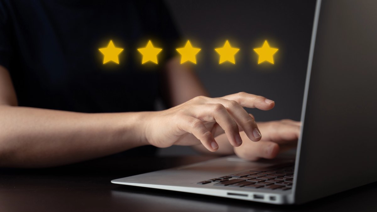 Review the Gillespie Approach - woman writing five-star review - Gillespie Approach–Craniosacral Fascial Therapy