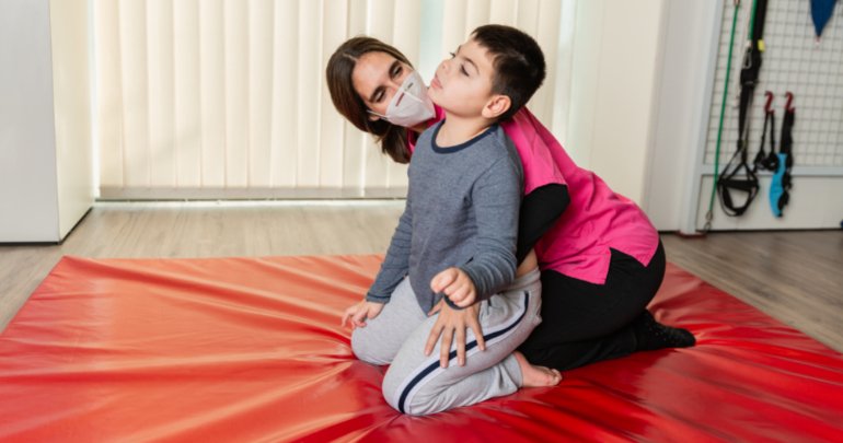 Cerebral palsy - therapist working with youth patient - Gillespie Approach–Craniosacral Fascial Therapy